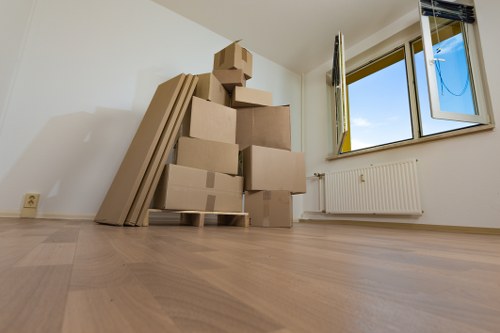 Removal crew loading boxes into a truck in a London move