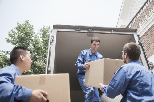 Loading boxes and furniture into a van for a London relocation