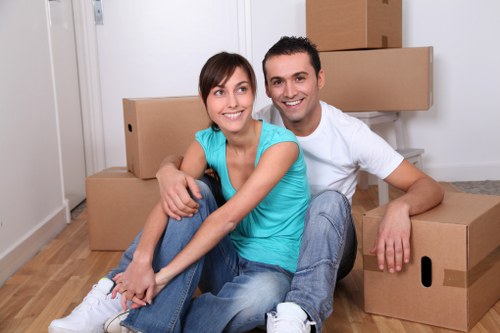 Careful moving of furniture through a London property