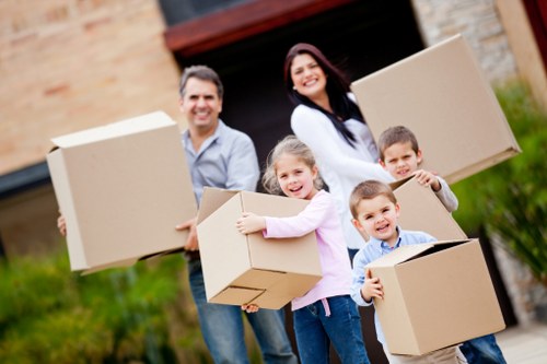 Business relocation with office furniture and labelled boxes in London