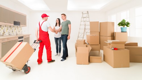 Packing and loading items into a van for a London removal job