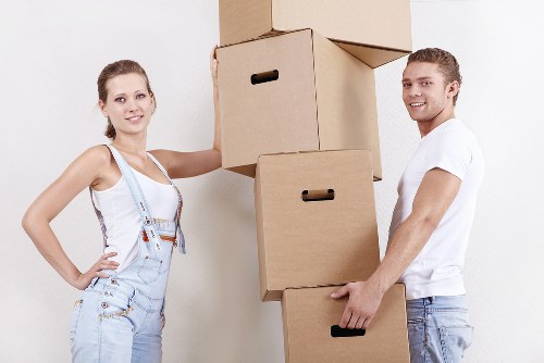 Business relocation team unloading office items at a London premises