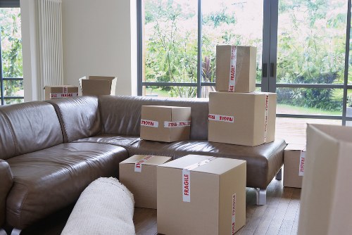 Careful unpacking of household items in a London flat