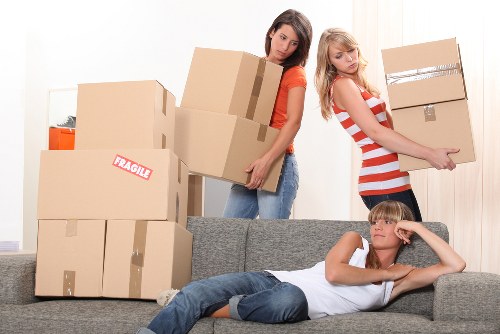 Removal team handling flat move logistics in a London building