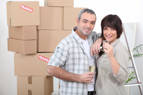 Careful loading of household items into a van in London