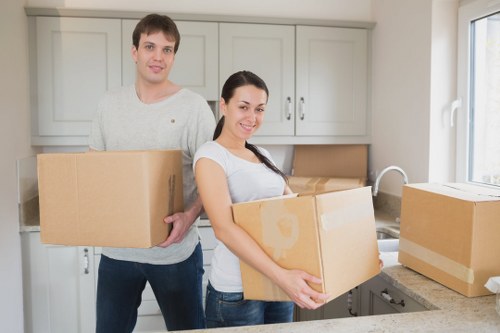 Furniture collection van loading unwanted items from a London property